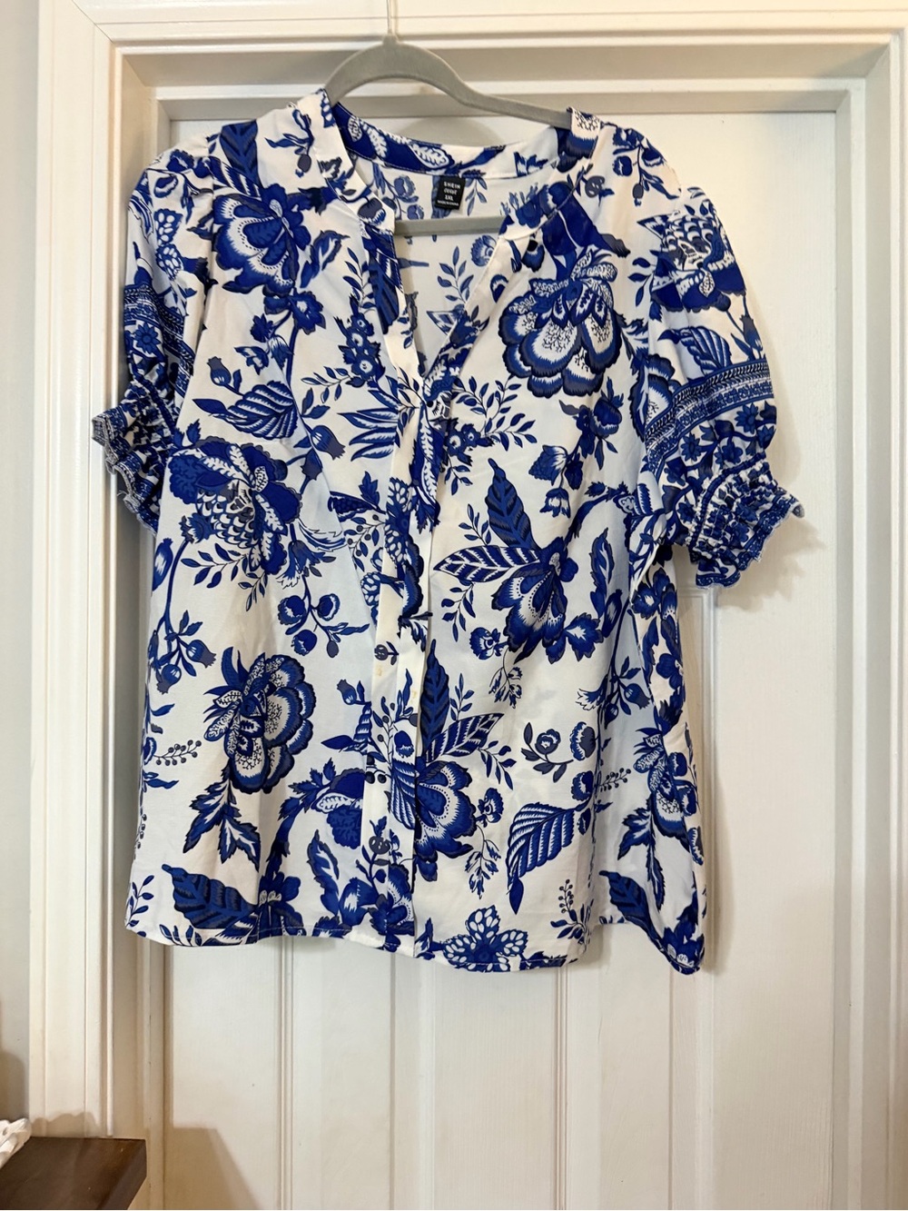 SHEIN White Button-Down Top with Blue Floral Pattern